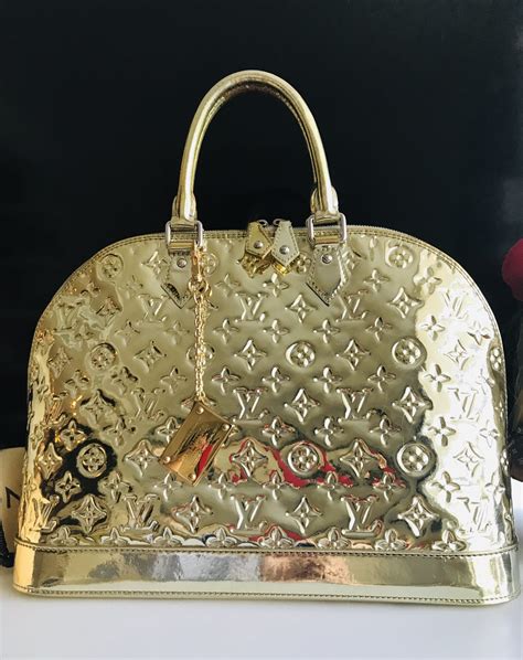 louis vuitton gold purse.